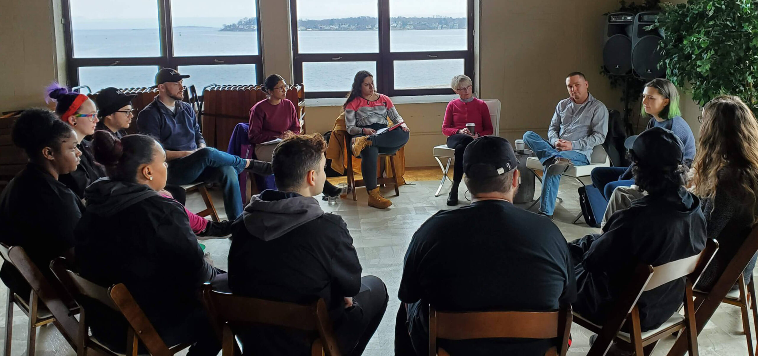 People sitting in a circle, talking
