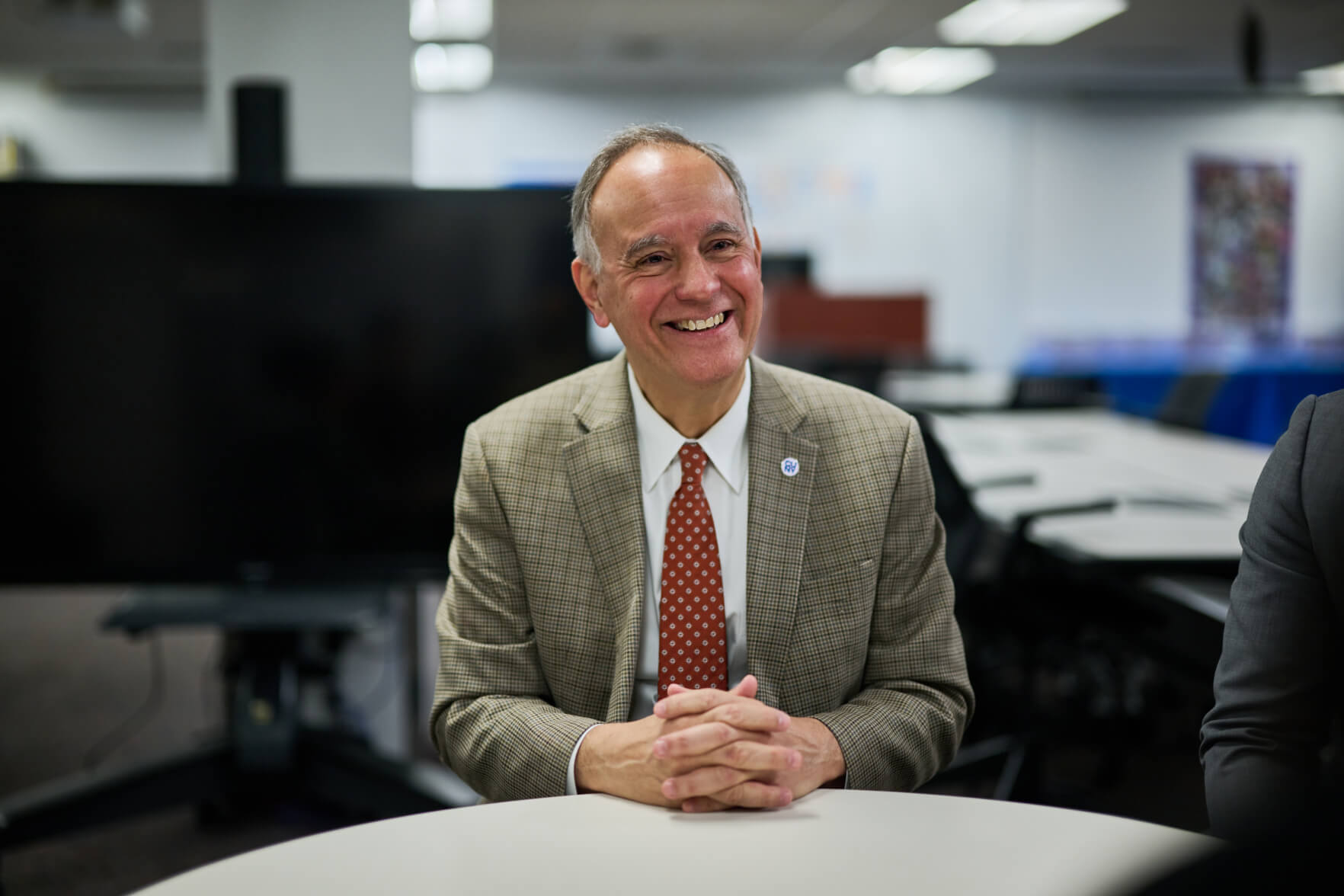 CUNY Chancellor Félix V. Matos Rodríguez sitting at a table